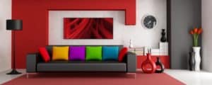 Colorful pillows on top of a grey couch graphic