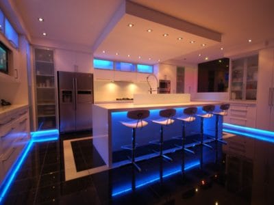 A modern kitchen with decorative LED lighting