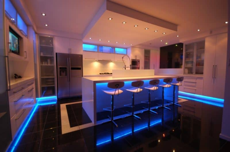 A modern kitchen with decorative LED lighting