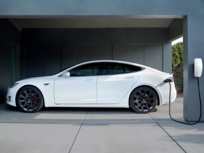 a tesla hooked up to a home charger vancouver