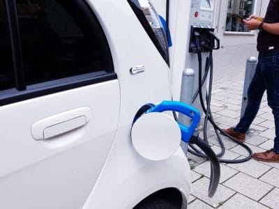 closeup of an electric vehicle using a charging station