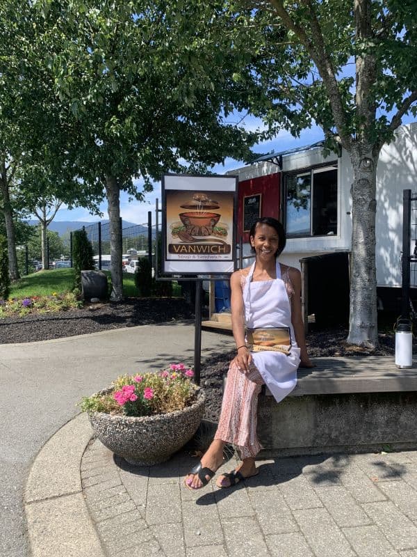 woman sitting in front of Vanwich food truck