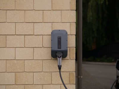 an EV charger installed on the exterior of a home with 200 amp service