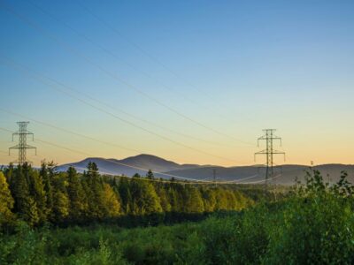 power lines in British Columbia with mountains in the background