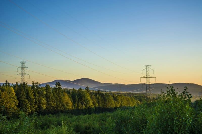 power lines in British Columbia with mountains in the background