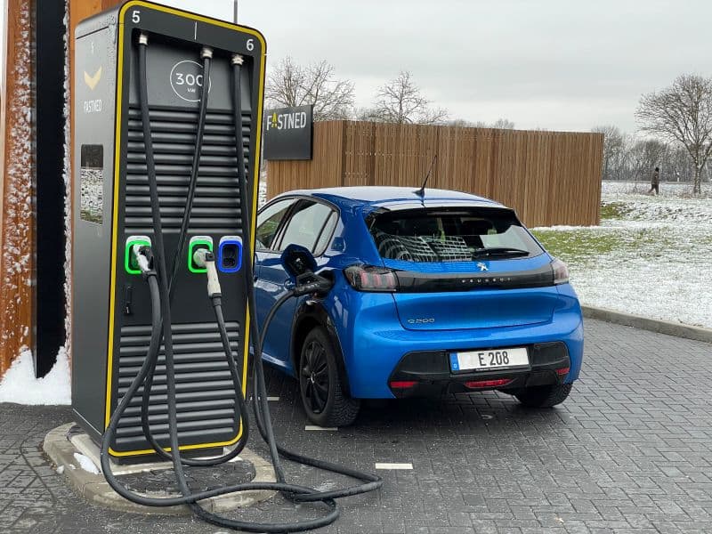 an EV charges using a combined charging system station