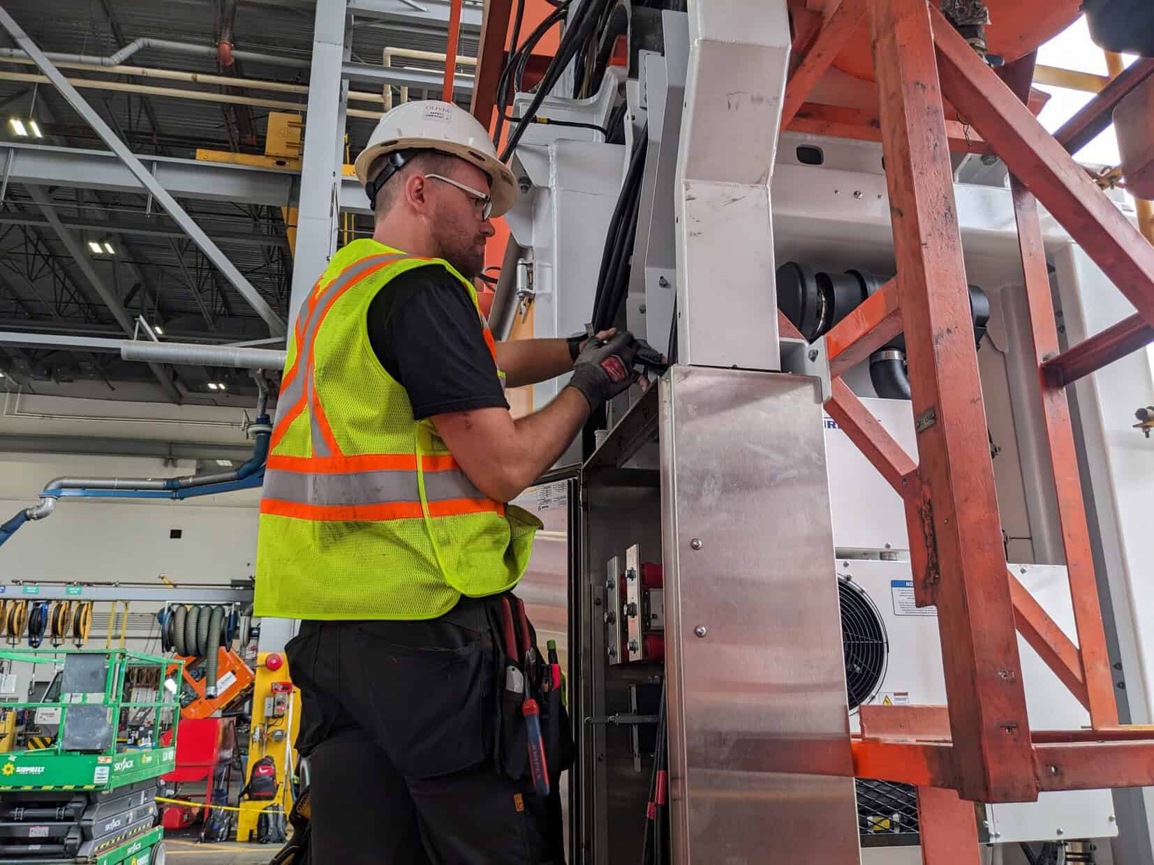 A TCA Electric staff fixing an electrical cord in Vancouver