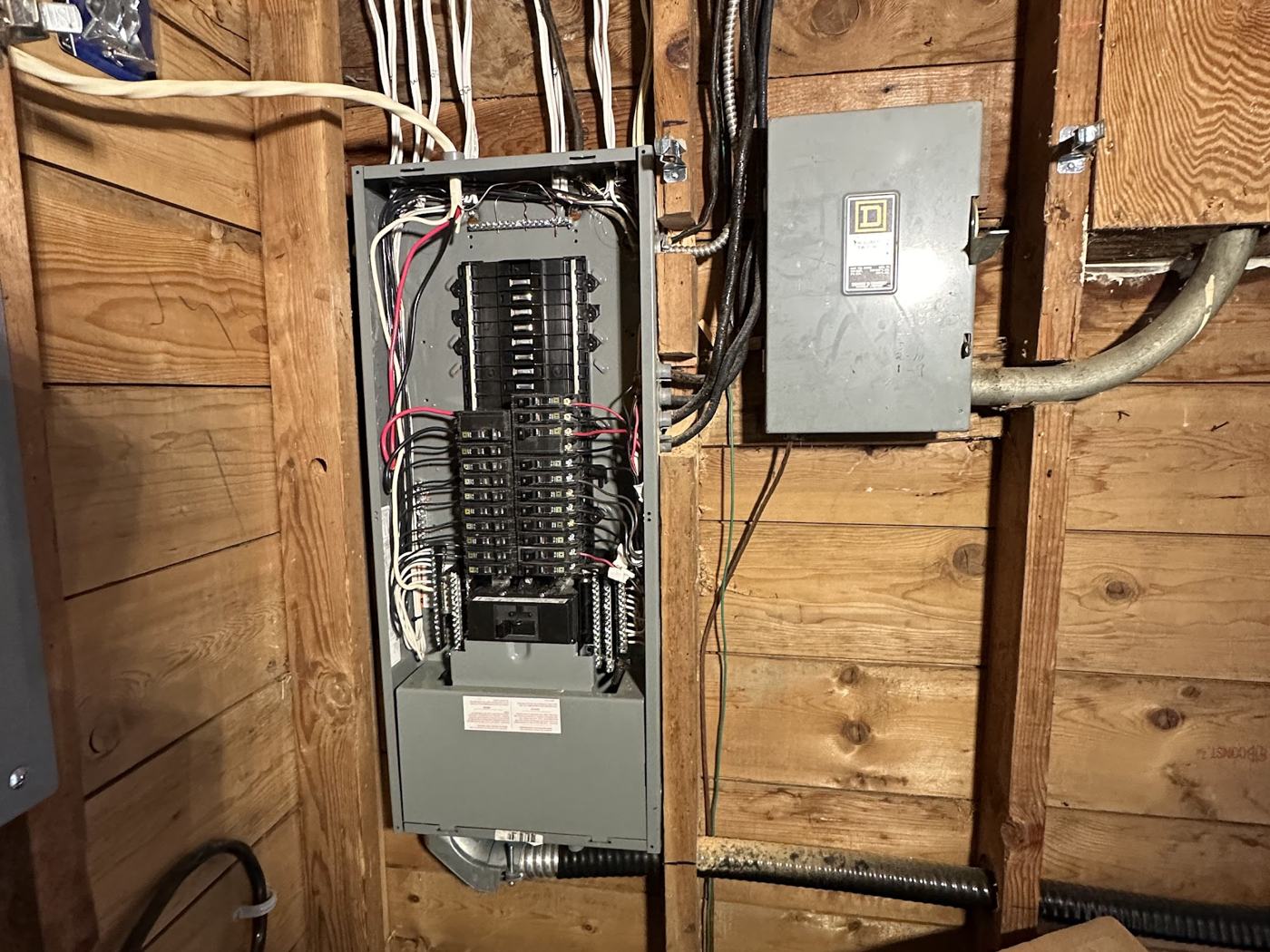 Older electrical panel in a Vancouver basement due for electrical panel replacement cost review