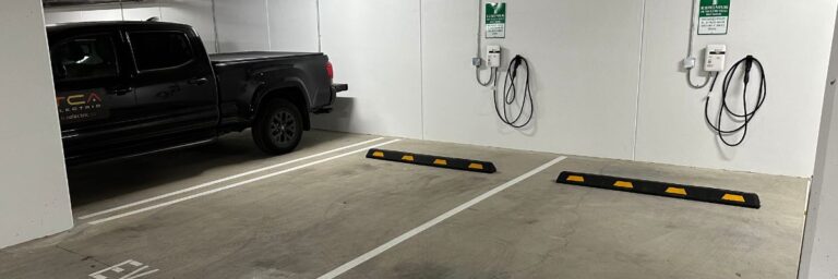 multi family ev chargers on wall in parking garage by TCA Electric in Vancouver, BC