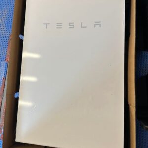 A white Tesla Powerwall unit with the "TESLA" logo in gray letters