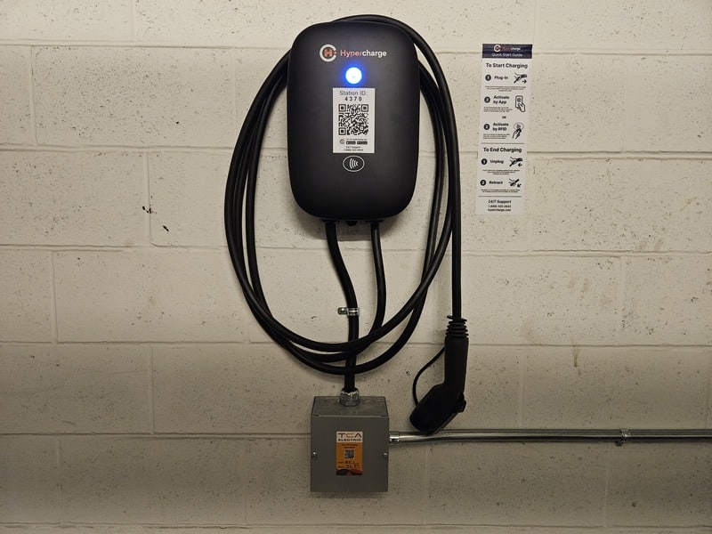 EV Charging on wall in parking garage by TCA Electric