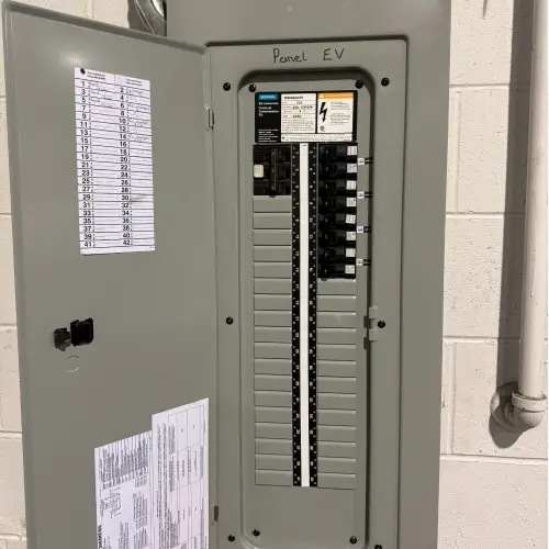 Open electrical panel labeled 'Panel EV' with Siemens breakers and circuit directory, representing the necessary electrical work for a commercial EV charging installation Vancouver by TCA Electric.