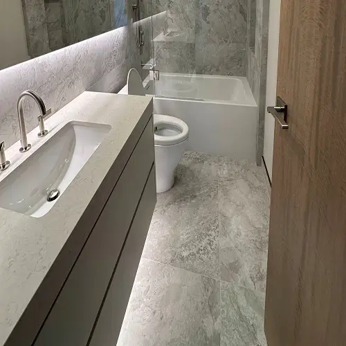 LED lighting upgrade featuring soft illumination around bathroom mirrors and under-sink accents by TCA Electric in Canada