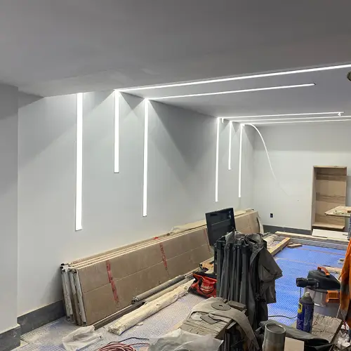 LED lighting strips installation underway in a renovated interior space by TCA Electric in Canada
