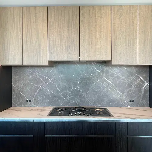 LED lighting upgrade illuminating a modern kitchen with under-cabinet lights by TCA Electric in Canada