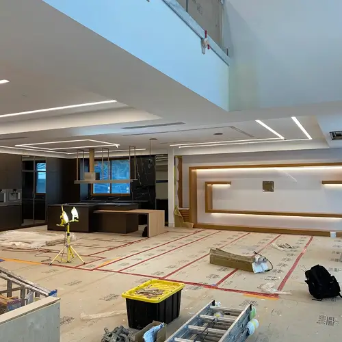 Open concept living area enhanced by recessed and linear LED lighting upgrade by TCA Electric in Canada
