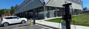 Modern public EV charging station beside a commercial building by TCA Electric in Denver